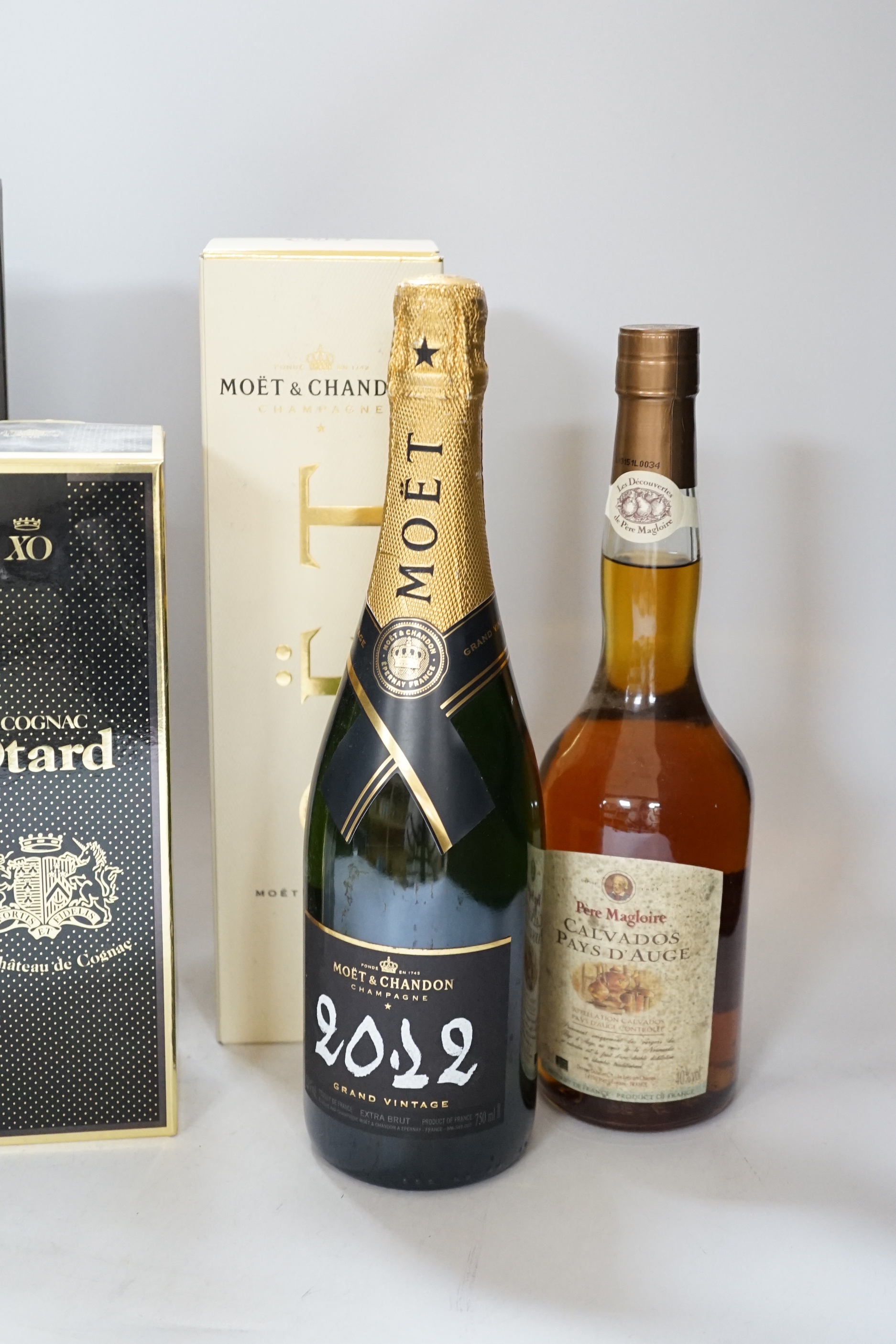 Three bottles of champagne including Moët, Otard Cognac and one other (5)